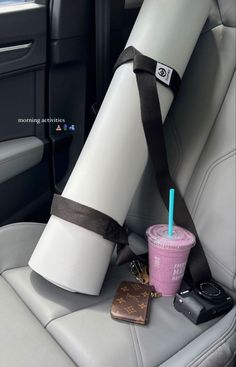 there is a cup with a straw in the back seat