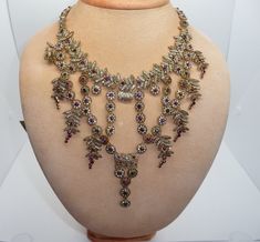 Stunning Vintage Statement Bib / Fringe Necklace by Zara Edwardian revival design Made from gold tone metal and featuring a cascade of flowers and leaves smothered in multi colour crystals The drop to the middle measures approx. 5 inches with the necklace measuring approx. 19 1/2 inches long to the end of the extender which can be used to shorten the necklace for that perfect fit Zara tag is attached to the end of the chain An absolutely fabulous runway statement necklace in great condition - a rare and hard to find piece of Zara jewellery Revival Design, Runway Necklace, Fringe Necklace, Bib Necklaces, Absolutely Fabulous, Crystal Gifts, Color Crystal, Flowers And Leaves, Organza Bags