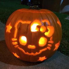 a pumpkin carved to look like a cat