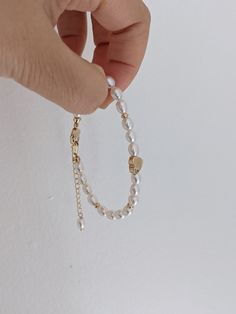 This White seed freshwater pearl and gold heart bracelet/Freshwater pearl bracelet with a golden heart/Gift for her/Mother's day gift uses AAAA quality freshwater seed pearls (5.5-6mm) and a 14k gold heart bead. It ends with a lobster claw closure and an extension chain (1.5 inches). This bracelet looks so elegant. It can be worn alone or be paired with a gold chain bracelet. The gold heart makes it look fresh and cute. It is made to order. The length is customized based on your wrist size. The Modern Pearl Jewelry, Gold Heart Bracelet, Pearl Bracelet Gold, Small Dangle Earrings, White Pearl Bracelet, Golden Heart, Jewelry Accessories Ideas, Freshwater Pearl Bracelet, Gold Bracelet Chain