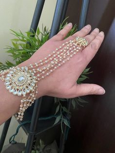 Adjustable Size Gorgeous high-end Gold champagne stones hath phool hath panja  hath paan Finger kundan bridal  bracelet hand harness Bracelet. Wrist size is 6.5inches sells in Single  Style guide: This bracelet is something that you put on .. It pairs fantastically with formals and casuals, adding a zing to them, and just a touch of glimmer! 100% Satisfaction Guarantee:Long Lasting Plating, High-Quality Stones. Gifting: Comes in Beautiful Gift Boxes. Occasion: Perfect choice for any Indian occas Adjustable Kundan Bracelets For Festivals, Adjustable Handmade Kundan Bracelets, Handmade Adjustable Kundan Bracelets, Traditional Adjustable Bracelets With Stone Work, Adjustable Kundan Bracelets For Festive Occasions, Adjustable Temple Jewelry Bracelets For Party, Adjustable Stone Work Bracelets As Gift, Adjustable Stone Work Bracelets For Gifts, Adjustable Kundan Bracelet Jewelry