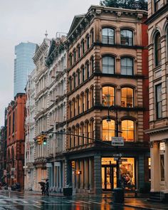 a city street with tall buildings on both sides