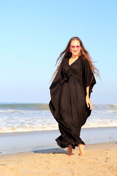 Summer travel is a breeze when your go-to dress is a maxi kaftan in super soft, rayon jersey knit fabric. Add metallic sandals and sparkly jewelry to get glam in a snap, or try it with earthy accessories for the perfect bohemian summer look. Subtle side slits from the knee down, keep movement in this kaftan easy and the fabric flowing. Available in a rainbow of colors. Fit: -Available in sizes: S ( 2-4), M (6-8), L (10-12) , XL (14-16) , XXL (18-20) See image 5 for size chart and color swatches. Black Maxi Dress For Summer Loungewear, Flowy Rayon Tunic Maxi Dress, Black Long Maxi Dress For Loungewear, Black Maxi Dress For Loungewear, Black Relaxed Fit Maxi Dress For Loungewear, Spring Maxi Dress With Batwing Sleeve And Flowy Fit, Spring Maxi Dress With Batwing Sleeves, Spring Flowy Maxi Dress With Batwing Sleeves, Bohemian Maxi Dress With Batwing Sleeves For Summer