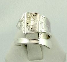 "Real vintage hand made sterling silver adjustable size spoon ring. Marked \"Sterling Pat. 1917\". A great conversation piece and fun to wear. FREE SHIPPING! Details: Sterling Silver: (shown in picture) Ring Size: 7 1/2 (adjustable) Total Weight: 10.2 grams FREE domestic shipping by USPS Priority Mail and includes insurance. If the item is to be shipped internationally Etsy will auto-calculate postage. Please notify us at purchase if you are buying more than one item and we will gladly combine s Art Deco Silver Signet Ring With Polished Finish, Silver Art Deco Signet Ring With Polished Finish, Antique Sterling Silver Adjustable Signet Ring, Adjustable Silver Rings For Commemoration, Picture Ring, Jewellers Bench, Resize Ring, Spoon Ring, Spoon Rings