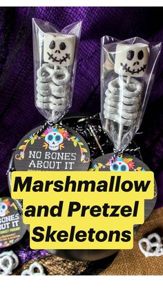 two plastic skeleton candy boxes with the words marshmallow and pretzel skeletons