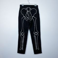 "Looking for a unique and edgy addition to your wardrobe? Look no further than these rhinestone skeleton jeans! Featuring a stunning design that combines the boldness of a skeleton with the sparkle of rhinestones, these jeans are sure to turn heads and make a statement. Crafted with high-quality denim and embellished with shimmering rhinestones, these jeans are both durable and stylish. The skeleton design adds a touch of rock 'n' roll to any outfit, whether you're dressing up for a concert or s Punk Style Costume Bottoms For Halloween, Punk Style Halloween Costume Bottoms, Punk Halloween Costume Bottoms, Halloween Jeans, Skeleton Jeans, Rhinestone Skeleton, Y2k Fits, Halloween Clothes, Rhinestone Jeans