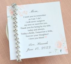 a card with a message written on it and a bracelet attached to the back of it