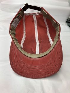 "This Waxed cotton cap in nautical red is meticulously handcrafted with quality materials and construction which results in a cap that will last for years! The front pockets will come in handy or just look cool. This water resistant material will age gracefully when handled. The cracking and wear marks of waxed cottons nature will add character to your own personal cap. The visor is 2.5\" long and the Sweatband is brushed cotton with absorbant felt inside. Fitted to any size." Pre-washed Cotton 5-panel Hat, Red Cotton Fitted Hat With Curved Brim, Cotton Flat Cap For Outdoor Use, Cotton Flat Cap For Outdoor, Classic Red Cotton Hat, Adjustable Red Six-panel Trucker Hat, Red Adjustable Six-panel Trucker Hat, Red Six-panel Cotton Baseball Cap, Vintage Canvas Baseball Cap With Curved Brim