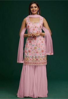 Semi-stitched Faux Georgette Pakistani Suit in Pink This Round Neck and Sleeveless attire with Poly Shantoon Lining is Prettified with Mirror Effect, Resham, Stone and Patch Border Work Available with a Faux Georgette Sharara and a Net Dupatta in Pink The Kameez and Bottom Lengths are 40 inches respectively Do note: The Length may vary upto 2 inches. Accessories shown in the image are for presentation purposes only.(Slight variation in actual color vs. image is possible). Sharara Suit Wedding, Pakistani Sharara Suit, Sharara Style, Pakistani Sharara, Pink Sharara, Suits For Women Indian, Georgette Sharara, Red Lehenga Choli, Sharara Suits