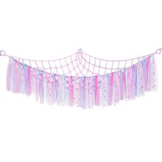 a pink and blue streamer hanging from the side of a white wall with stars on it