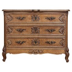 an old wooden dresser with ornate carvings on the top and bottom drawer, isolated against a white background