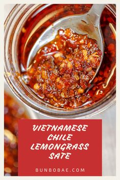 a spoon full of vietnamese chili lemongrass sauce in a jar with text overlay