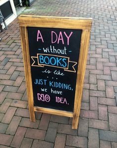 a sign on the sidewalk that says a day without books is like just kidding, we have no idea