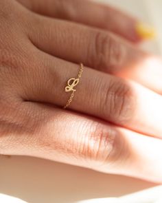 Dainty 14K Initial Letter Ring: Barely there ring in 14k Gold with a small script Letter  Modern and timeless Super Dainty Link Chain Ring Simple, minimalist everyday Alphabet Initial Ring - Perfect as a stacking ring or by itself. Each initial measures approx. 4.8mm Available in 14K Yellow Gold or 14K White Gold SIZE: US4.5 - 10 Letter: A-Z or an heart charm * Leave us your initial in the comment box at checkout. # Personalized ring Statement rings meaningful gift mom ring chain ring initial chain alphabet letter name ring solid gold ring dainty ring gold chain rings statment ring cuban link chain 14K gold everyday ring jewelry rings ■ SHIPPING UPGRADES You can find shipping upgrades options in the drop bar menu when you check out. * Within the U.S Regular First-class : 2-6 business days Chain Ring Gold, Ring Initial, Chain Rings, Mom Ring, Dainty Gold Rings, Letter Ring, Ring Chain, Personalized Ring, Diamond Free