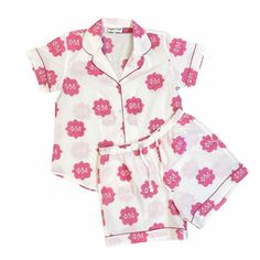 "Celebrate your Phi Mu sisterhood!  Every single print has been block printed by HAND by our amazing artisans and each pajama is individually sewn. These short sleeve / shorts are amazingly comfy and adorable all at the same time.  Details such as the piping and pockets make these pajamas perfect to lounge in, sleep in, or just about do anything in!   100% lightweight cotton with hand block printed design True to size, shorts come with elastic waist and pockets Size US Ladies Size Bust XS 0-2 34\" S 4-6 36\" M 8-10 38\" L 10-12 41\" XL 12-14 45\"     Care & Cleaning: wash cold with like colors in delicate cycle.  Best to line dry." Cute Cotton Pajama Shorts With Relaxed Fit, Printed Cotton Pajama Shorts For Sleep, Printed Cotton Pajama Shorts For Bedtime, Cotton Printed Pajama Shorts For Bedtime, Cotton Printed Pajama Shorts For Sleepover, Cotton Graphic Print Sleepwear For Pajama Party, Cotton Pajama Shorts Matching Set For Sleep, Matching Cotton Sets With Short Sleeves, White Cotton Pajama Shorts For Home