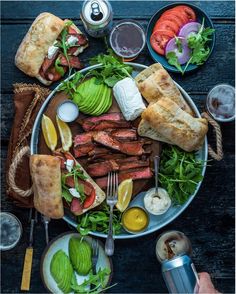 a plate full of food and drinks on a table