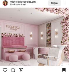 a room with pink furniture and flowers on the walls