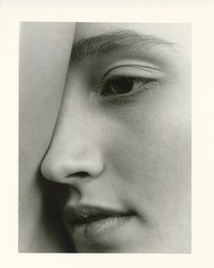 a black and white photo of a woman's face