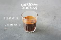 an americano coffee in a tall glass with the ingredients to make it look old fashioned