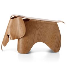 an elephant shaped wooden stool on a white background