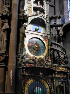 an ornate clock in the middle of a building