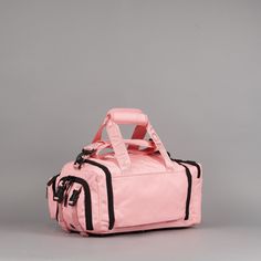 This is a MINI Duffle, check the size before ordering! Introducing your new mini travel companions: Perfect for carrying essentials. Whether it's for a quick gym session, a day trip, or as a carry-on during travel or range bag... these bags are designed to hold just enough without being bulky or cumbersome Perfect for Adults and/or Children The 20L Mini Duffle Bag made with 1000D Oxford Waterproof Material and YKK Zippers and Clamps. This exceptional bag is meticulously designed to cater to all Functional Travel Bag With Adjustable Strap, Functional Gym Bag For Daily Use, Sporty Rectangular Duffle Bag With Functional Pockets, Functional Travel Bag With Top Carry Handle, Sporty Rectangular Luggage For Everyday Use, Sporty Luggage With Functional Pockets For Everyday Use, Functional Duffle Bag For Outdoor With Top Handle, Functional Pink Bag For Outdoor Activities, Functional Gym Bag With Adjustable Strap For School