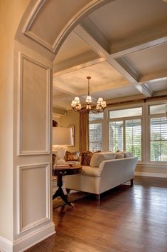 the living room is clean and ready to be used as a den or home office