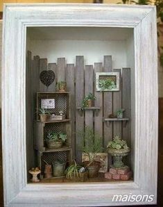 a white frame with some plants in it