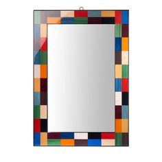 a colorful mirror hanging on the wall