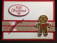 a handmade christmas card with a ginger holding a candy cane, and the words merry christmas on it