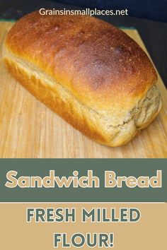 a loaf of bread sitting on top of a wooden cutting board with text overlay reading sandwich bread fresh milled flour