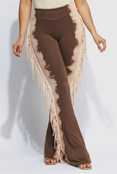 "Soft Mineral Wash Fringe Cowgirl Yoga Pants! This Fringe Fold over Yoga Pants can be used in all the seasons. A timeless silhouette with western-inspired fringe trim detailed bell bottoms, this is perfect for a night out on the town. Great with cowboy boots! PRODUCT DETAILS: *cotton/polyester*  WASH CARE:  Wash cold Color separate *Do Not Bleach* *  Made in United States *  Care Instructions: Machine wash \"Buyer is responsible for return shipping costs and any loss in value if an item isn't re Wide Leg Fringe Pants For Fall, Wide Leg Pants With Fringe For Fall, Casual Bottoms With Tassels, Bohemian Tassel Bottoms For Fall, Fall Wide Leg Bottoms With Fringe, Bohemian Brown Fringe Bottoms, Bohemian Brown Bottoms With Fringe, Fitted Bottoms With Tassels For Spring, Fitted Bottoms With Tassels For Festival