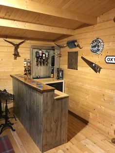 a wooden bar in the corner of a room