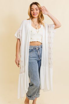 Introducing our Boho Tribal Embroidered Longline Kimono – a statement piece that effortlessly blends style and cultural flair! This longline kimono features intricate tribal embroidery, adding a bohemian touch to your wardrobe. With a relaxed fit and flowing silhouette, it's perfect for layering over any outfit. Whether you're hitting the festival scene or looking for a boho-chic layer for everyday wear, this kimono has you covered. Elevate your style with the Boho Tribal Embroidered Longline Kimono – where fashion meets cultural inspiration in one stunning piece! #lovemyleto 100% Viscose Imported Spring Folk Style Embroidered Kimono, Spring Folk Kimono With Floral Embroidery, Bohemian Embroidered Kimono With Kimono Sleeves, Spring Folk Long Kimono, Embroidered Kimono For Spring Festival, Long Floral Embroidered Kimono For Festival, Long Floral Embroidery Kimono For Festivals, Bohemian Kimono With Intricate Embroidery, White Boho Print Kimono For Festival