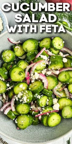 cucumber salad with feta and red onions in a bowl on a table