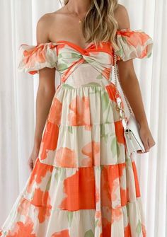 This stunning off the shoulder midi dress boasts puff sleeves, a sweetheart neckline, and a twist front bodice with a keyhole cutout. Adorned with a vibrant orange, cream, and green floral print, it's perfect for any occasion. Flattering and stylish, it's a must-have addition to your wardrobe. Size Guide Size Bust Sleeve Length Waist S 33.07 9.84 45.67 24.80 M 34.65 10.24 46.06 26.38 L 37.01 10.63 46.46 28.74 Casual Party Dresses, Sleeves Clothing, Weave Style, Puff Sleeve Dresses, Self Design, Design Fabric, Invisible Zip, Puffed Sleeves Dress, Maxi Dress With Sleeves