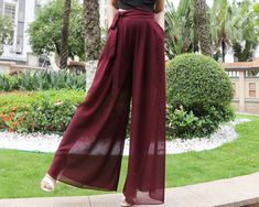 * A pair of chiffon pants, wide leg hem, like a skirt.  * Lightweight high quality chiffon fabric, fit for summer. * With a same color belt, you can tie it as a decoration. * Materials: hight quality pearl chiffon(100% polyester) Shop sizing chart FYI ( actual body figures, not laying flat clothes measurements) Size XS (US 2, UK 6, German 32, French 34) Bust: fits bust around 33.5 inches/85cm Waist: fits waist around 26 inches/66cm Hips: fits hips around 36 inches/91cm Size S (US 6, UK 10, Germa Chiffon Trousers, Chiffon Pants, Summer Pants Women, Fits For Summer, Body Figure, Pants Elastic Waist, Pants Summer, Summer Pants, Elastic Waist Pants