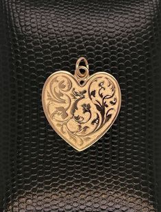 14kt solid gold heart is exceptionally detailed, made from a hand engraved model. Measuring 29mm by 24mm ( without ring). A future heirloom. 6.7g. Money back guarantee within 14days. Buyer pays return shipping and must be returned in original condition with box and no alterations. Valentine's Day Yellow Gold Jewelry With Intricate Design, Heirloom Heart-shaped Jewelry With Intricate Design, Victorian Yellow Gold Jewelry For Valentine's Day, Heirloom Engraved Jewelry For Valentine's Day, Heart-shaped Jewelry With Intricate Design For Formal Occasions, Formal Heart-shaped Jewelry With Intricate Design, Victorian 14k Gold Heart-shaped Jewelry, Antique Heart-shaped Yellow Gold Jewelry, Victorian 14k Gold Heart Shaped Jewelry