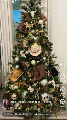 a christmas tree decorated with hats and other holiday decorations is seen in this photo taken on the iphone