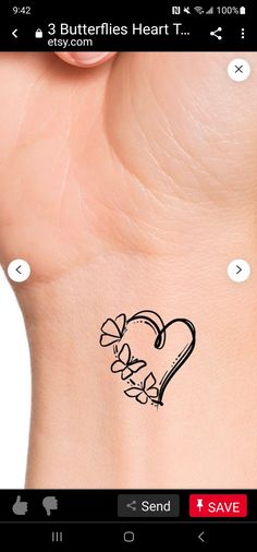 an image of a heart tattoo on someone's wrist