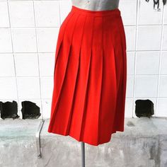 Waist 26 inchesLength 26 inchesBeautiful, bright red. Excellent condition. Unlined. Wool. Red Retro Pleated Skirt, Red Knee-length Pleated Skirt For Spring, Retro Red Pleated Bottoms, Red Fitted Full Pleated Skirt, Fitted Red Full Pleated Skirt, Red Pleated A-line Skirt, Red A-line Pleated Skirt, Retro Red Skirt For Spring, Classic Red Skirt