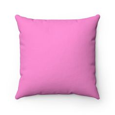 a bright pink pillow on a white background