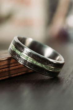 Interstellar-meteorite-dust-imperial-diopside-titanium-mens-wedding-band-rustic-and-main Modern Ring Design, Mens Wedding Rings Titanium, Wedding Band For Him, Meteorite Wedding Rings, Mens Wedding Rings Unique, Meteorite Wedding Band, Groom Ring, Wood Wedding Band, Titanium Wedding Rings