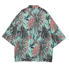 Our Tropical Kimono Shirt, a perfect blend of exotic flair and comfortable style. Embrace the vibrant energy of the tropics with this beautifully designed shirt that is sure to make a statement wherever you go. Crafted with care, our Tropical Kimono Shirt features lightweight and breathable fabric, making it ideal for warm weather and beach destinations. Its loose and flowing silhouette offers both comfort and versatility, allowing you to effortlessly transition from lounging poolside to explori Hawaiian Beach Shirt With Graphic Print, Summer Patterned Shirt With Graphic Print, Patterned Summer Shirt With Graphic Print, Hawaiian Graphic Print Top With Camp Collar, Summer Hawaiian Shirt With Graphic Print, Hawaiian Top With Graphic Print And Camp Collar, Hawaiian Camp Collar Graphic Print Tops, Hawaiian Camp Collar Top With Graphic Print, Summer Beach T-shirt With Camp Collar