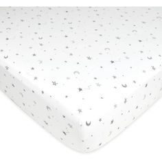 a white sheet with stars and moon designs on it, in front of a white background