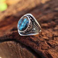 Inspiration: Our Fire Labradorite Antique Silver Ring draws inspiration from ancient myths and legends. It's said that labradorite carries the magical essence of the Northern Lights, and we've captured that enchantment in this exquisite piece. Imagine owning a ring that channels the energy of mystical realms, just like a character from a fantasy novel. Creation Process: Each of these rings is meticulously handcrafted by skilled artisans. We select the finest fire labradorite gemstones and set them in antique silver to create a vintage-inspired masterpiece. The creation process involves a touch of magic and a lot of dedication, resulting in a one-of-a-kind ring. Who Can Wear It: This ring is perfect for women who appreciate unique and meaningful jewelry. It's designed for those who want to Mystical Labradorite Rings With Natural Stones, Bohemian Labradorite Cabochon Rings, Bohemian Blue Labradorite Rings, Ring For Women Unique, Antique Silver Rings, Her Ring, Larp Costume, Ancient Myths, Unique Holiday Gifts