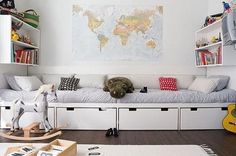 a child's room with a bed, rocking horse and bookshelves on the wall