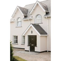 a white house with black door and windows