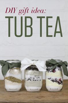 three jars filled with different types of tea sitting on top of a wooden table next to a sign that says diy gift idea tub tea