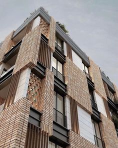 a very tall building with many windows and balconies